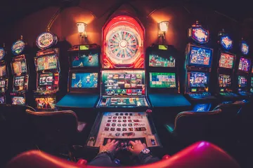 A close-up shot of golden coins falling around a spinning roulette wheel, representing immersive casino action at AMJILI.