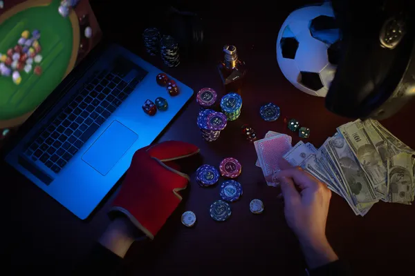 A glowing roulette wheel with cascading chips, symbolizing the engaging live and instant-win games available on AMJILI.